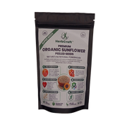 HerbCraft Premium Organic Sunflower Peeled Seeds 100g pouch ka front view, sunflower seeds ki illustration aur product name ke saath, black background par, docxora.com Pakistan.