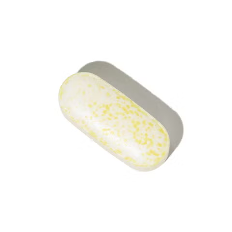 GNC Alpha-Lipoic Acid 600mg Caplet Closeup - cream white oval caplet with yellow speckles close-up view
